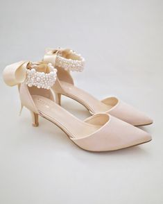 Elegant Pearl Ankle Strap Wedding Shoes, Elegant Pearl Wedding Shoes With Ankle Strap, Feminine Wedding Shoes For Guests, Elegant Ankle Strap Wedding Shoes For Bridesmaids, Pearl Embellished High Heels, Low Heel Wedding Shoes With Satin Bow, Elegant Low Heel Bridesmaid Heels, Chic Pearl Embellished Ankle Strap Wedding Shoes, Elegant Wedding Shoes With Satin Bow And Ankle Strap