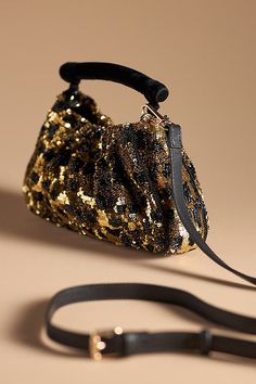 Glass beads, acrylic sequins; cotton lining Removable crossbody strap One inner slip pocket Magnetic closure Imported | Sequin Animal Clutch by Anthropologie, Women's, Cotton/Acrylic/Glass Beaded Crossbody Bag, Acrylic Clutch, Foldover Clutch, Beaded Clutch, Crossbody Bag Women, Leather Clutch, Crossbody Strap, Magnetic Closure, Bags Women