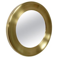 a round mirror is shown against a white background