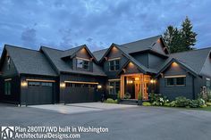 a large house with lots of windows and garages