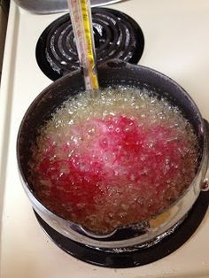 a pan filled with food sitting on top of a stove next to a burner