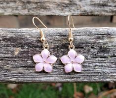 These cute little Sakura flower (cherry blossom) earrings would make a great gift. You can choose your color: white, pink, lavender, or turquoise. The flowers measure 1/2 inch wide. The hooks are nickel-free. This would make a great gift for a bridesmaid or a birthday, an anniversary or Christmas. All jewelry items come in a gift box. Follow this link for a matching necklace... https://www.etsy.com/listing/758932422/sakura-necklace-cherry-blossom-necklace?ref=listings_manager_grid Cute Flower Charm Earrings For Gift, Cute Flower Charm Earrings As Gift, Pink Flower Earrings As Gift For Her, Cute Gold Flower Earrings For Gift, Pink Flower Earrings For Her, Cute Flower Earrings For Mother's Day Gift, Rose Gold Flower Earrings For Gift, Rose Gold Flower Earrings As Gift, Cute Flower Earrings For Gift