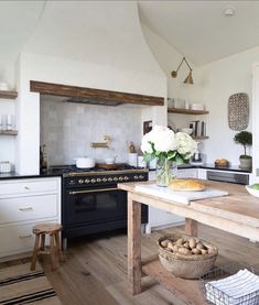 a kitchen with an oven, stove and counter top in it's center island