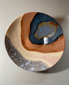 a plate with an orange and blue design on it