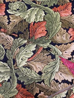 a close up view of the fabric with leaves on it