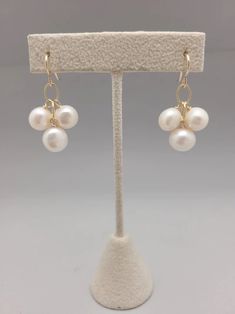 Three freshwater pearls dangle from gold filled chain. Simple, sophisticated and easily dressed up or down all year long. Lightweight and perfect for bridesmaids or graduation gifts.  All pieces will be packaged together in a cotton filled jewelry box unless otherwise specified. Please let us know if your order is a gi 14k Gold-filled Pearl Pendant Earrings For Wedding, 14k Gold Filled Pearl White Dangle Pearl Earrings, Delicate Wire Wrapped Pearl Earrings, Elegant White 14k Gold Filled Jewelry, 14k Gold Filled Pearl Drop Jewelry For Gift, Elegant 14k Gold-filled Pearl Earrings For Formal Occasions, 14k Gold Jewelry For Bridesmaid Gift, Elegant Formal 14k Gold Filled Pearl Earrings, Pearl White Wire Wrapped Jewelry For Gift