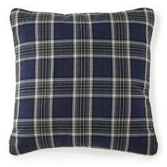 a blue plaid pillow on a white background