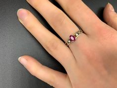 Handmade, antique ruby ring in 925 silver. It was manufactured in Germany in the 1960s and professionally reworked by a goldsmith in the 2000s.The ring has a 925 stamp inside and is studded with a ruby (approx. 6 mm x 4 mm x 1.5 mm). It is size 16 (56 1/2 or 7 3/4 in USA/ PQ in UK) More precisely the inside ring measures 19 mm x 19 mm x 2 mm at the narrowest point. The outer dimensions of the ring are 21 mm x 24 mm x 6 mm. The ring weighs 12,410 carats.On request with certificate of authenticity Red Pink Sapphire Rings, Hallmarked Emerald Cut Ruby Ring, Pink Ruby Rings With 17 Jewels, Hallmarked Pink Ruby Rings, Ruby Diamond Promise Ring Hallmarked, Pink Ruby Ring Hallmarked, Ruby Diamond Promise Ring, Emerald Cut Ruby Ring With Hallmark, Antique Ruby Ring