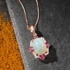 Ross-Simons - Ethiopian Opal, .20ct t. w. Ruby Pendant Necklace, Diamond Accents. 18". Like an enchanting art piece, this pendant necklace showcases an iridescent 7x9mm Ethiopian opal rectangle cabochon in a fanciful frame of .20 ct. t. w. rubies with diamond accents. Crafted in glowing 14kt rose gold. Box chain includes 2" extender. Lobster clasp, ruby and Ethiopian opal pendant necklace. Ruby birthstones are the perfect gift for July birthdays. Diamond White Necklaces For Gifts, Diamond White Necklaces With Jewels For Gift, Fine Jewelry Large Pendant For Anniversary, Fine Jewelry Necklace With Large Pendant For Anniversary, Anniversary Necklace With Diamond Accents And Rectangular Pendant, Anniversary Necklace With Rectangular Diamond Pendant, Formal White Jewelry With Rectangular Pendant, White Rectangular Pendant Jewelry For Formal Occasions, Formal Rose Gold Jewelry With Large Pendant