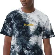 a young man wearing a tie - dyed hustle t - shirt