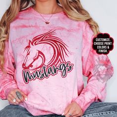 Show off with this custom and personalized Mustangs mascot design. These shirts and sweaters are great gifts for school teams, camp spirit wear, Mustangs coaches, Mustangs teachers, Mustangs Moms, Dads, girlfriends, and the whole family! You can customize the colors in the personalization section to reflect your favorite Mustangs team. It is trendy to size up 2 sizes for an oversized look or size down for a tighter fit.  To add a name (and or number) to the back of a shirt, add lounge pants, expedite processing, add overnight shipping, and any other miscellaneous items- please follow this link: https://www.etsy.com/shop/KASPDesign?ref=seller-platform-mcnav§ion_id=27547745 The listing is for one garment. To order... 1. Select the style and size you would like, then the color for the garment School Spirit Sublimation Crew Neck For Sports Season, College Fan Apparel With Team-colored Sublimation Design, College Sports Fan Sublimation Design, Varsity Sublimation Print Design For College, Game Day School Spirit Sublimation Crew Neck, Custom Print Sweatshirt For Game Day With Team Spirit, Customizable Team-colored Sublimation Design For School Spirit, Fan Apparel Sweatshirt With Custom Print For Sports Events, Team-colored Sweatshirt For School Spirit