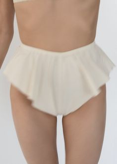 Parchment Poplin Flutter Shortie - High Cut Fluttery Sides with Baby Merrow Hems - Gathered Elasticized Waist Band - French Seams - Soft Crisp Japanese 100% BCI Cotton - BCI Cotton - https://bettercotton.org - Fitted - Made in USA Worn with Gathered Bralette White Cotton Bloomers With Ruffles, White Cotton Ruffled Bloomers, Stretch Bottoms With Ruffles In Solid Color, Cotton Ruffled Short Bloomers, Cotton Ruffled Bloomers, Fitted Cotton Shorts With Ruffles, Fitted Cream Bottoms With Ruffles, Fitted Cotton Bloomers With Ruffles, Stretch Cotton Ruffled Shorts