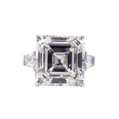 A truly spectacular piece featuring a treasure from the J. Birnbach vault. This magnificent ring features a 21.13 carat GIA certified Asscher cut of H color and VS1 clarity. Tapered baguettes are a timeless accent to the center diamond-this pair totals approximately 1.50 carats. The ring is crafted in platinum, and destined to be an heirloom piece beloved for generations. Custom engraving and sizing available. Bold Engagement Rings, Ascher Cut, Radiant Cut Diamond Ring, Cushion Diamond Ring, Brilliant Cut Diamond Ring, Emerald Cut Diamond Engagement, Contemporary Engagement Rings, Emerald Cut Diamond Ring, Engagement Ring Prices