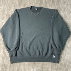 Vintage 90s Russell Athletic Basic Blank Sportswear Made in USA Streetwear Green Pullover Crewneck Extra Large Mens Condition:  Excellent Used Condition  = No Flaws Measurements: Please see photos above for all measurements IF YOU BUY TWO OR MORE ITEMS USE THE CODE BUNDLE @ CHECK TO SAVE 20% WE SHIP WITHIN 24 HOURS AFTER PURCHASE! Please be aware that we do not offer free returns!! The Buyer is responsible for the cost of the return label.  Follow us on TikTok & Instagram @findsnostalgic and tag Casual Solid Color Sweater For Sports, Casual Solid Sweater For Sports, 90s Oversized Sweatshirt For Sports, 90s Style Relaxed Fit Sports Sweatshirt, 90s Style Relaxed Fit Sweatshirt For Sports, 90s Style Winter Sports Sweatshirt, 90s Crew Neck Sports Sweatshirt, 90s Style Long Sleeve Sports Sweatshirt, Green Pullover