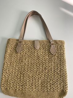 This unique and stylish handmade bag is meticulously crafted from quality paper yarn. Each one is expertly hand-knitted and finished with stylish leather handles, making the bag both durable and stylish. Since it is completely handmade, each bag may have slight differences, which means each one is unique. Product Features: 🌿 Material: High-quality paper yarn and durable leather handles 📏 Size: Large interior volume, ideal for daily use and beach needs 🎨 Color Options: Different color and size Eco-friendly Crochet Bag With Woven Leather, Eco-friendly Woven Leather Crochet Bucket Bag, Eco-friendly Crochet Bag With Woven Leather Details, Eco-friendly Jute Crochet Bag With Woven Leather, Eco-friendly Crochet Jute Bag With Woven Leather, Eco-friendly Crochet Shoulder Bag With Woven Leather, Natural Woven Leather Crochet Bag For Everyday Use, Beige Crochet Bag With Woven Leather, Eco-friendly Woven Leather Crochet Bag For Daily Use