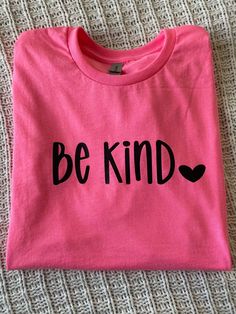 Be kind tee! Super fun bright pink colored shirt! Perfect for layering or on its on. Pink Fun T-shirt With Screen Print, Fun Pink T-shirt With Screen Print, Fun Pink T-shirt With Text Print, Trendy Pink T-shirt With Heart Graphic, Pink Crew Neck T-shirt For Valentine's Day, Pink Cotton Tops For Valentine's Day, Pink Cotton Top For Valentine's Day, Pink Tops With Funny Print For Valentine's Day, Pink T-shirt With Funny Print For Valentine's Day