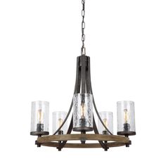 a chandelier with five lights hanging from it's center and four glass shades on the bottom