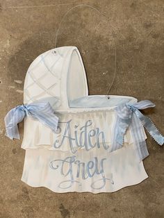 an infant's crib with the word aten free on it and blue ribbon