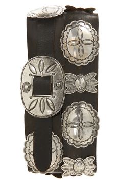 Made in collaboration with renowned Navajo silversmith Jimmy Begay, this hand-finished belt is meticulously rendered using traditional wax casting techniques. The design—reminiscent of Navajo Third Phase concho belts—features cast silver-plated brass pieces with repoussé and traditional stamped motifs, alternating between butterflies and oval conchos, and a single-prong oval-shaped buckle on a vegetable-tanned leather strap. Leather Made in the USA Black Western Belt, Concho Belts, Belt Buckles Men's, Cowboy Belt, Western Accessories, Concho Belt, Ralph Lauren Style, Purple Label, Wax Casting