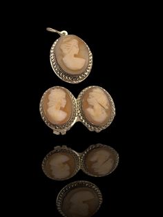 "This vintage 800 silver hand carved Shell Cameo set is  just beautiful and very classy! The earrings and  matching pendant are  in superb condition, ready for wearing  The carvings depict pretty women in profile with curly hair, The three women are all different, as is normal that it is, since it is a handmade work Every oval cameo section has delicate & decorative ruffled edge,  and the Shell is bezel set with open back Expertly crafted, Elegant and graceful work,  this 1960's vintage silver C Victorian Cameo Earrings For Formal Occasions, Elegant Silver Carved Earrings, Elegant Cameo Clip-on Earrings Gift, Classic Cameo Earrings For Wedding, Antique Clip-on Jewelry For Wedding, Antique Clip-on Wedding Jewelry, Antique Silver Clip-on Earrings For Wedding, Victorian Oval Clip-on Jewelry, Antique Clip-on Jewelry As Gift