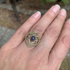 This ring makes a gorgeous statement. The polished black onyx stone is set in brass floral tribal design details. The back is open to allow direct contact with the stone. Ring is approx 7/8”length on face US size 7.75 Nickel-free Spiral Metal Jewelry, Spiral Wire Wrapped Brass Jewelry, Spiral Brass Wire Wrapped Jewelry, Nickel-free Spiral Brass Jewelry, Spiral-shaped Pierced Metal Jewelry, Spiritual Spiral Metal Jewelry, Nickel-free Bronze Spiral Jewelry, Black Onyx Stone, Macrame Earrings