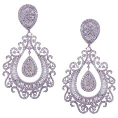 These pear swirl chandelier earrings are crafted in 18-karat white gold, weighing approximately 13.31 total carats of SI-V Quality white diamond. French clip backing. Our Ballroom Chandelier Collection feature earrings for those with bold/classy aesthetics and elegant tastes. 612 Round Diamonds = 9.26 ct 150 Baguette Diamonds = 4.05 ct Swirl Chandelier, Ballroom Chandelier, Classy Aesthetics, Argentium Silver Jewelry, Jewelry Design Drawing, French Clip, Diamond Dangle Earrings, Baguette Diamonds, Big Earrings