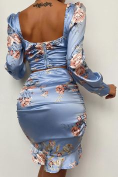 Add some elegance to your wardrobe with this sexy yet chic two-piece dress, crafted from high-quality shiny satin, and printed with an adorable floral design with a blue theme. This co-ord set is featuring a nice square neck crop top with long bishop sleeves with a cuffed end and has a back zipper closure, paired with a sexy high-waisted bodycon skirt with ruffle hems and elastic waistline. Details: Women Set Blue Floral Print Satin Dress High Waist Two Piece Ruffle Squareneck Puffed Bishop Long Print Satin Dress, Printed Satin Dress, Crop Top Skirt Set, Stylish Work Attire, Wedding Attire Guest, Top Skirt Set, Crop Top Skirt, Blue Floral Print, Trend Fashion