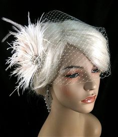 "Bridal Fascinator Feather Wedding Head Piece Feather Fascinator Bridal Hair Accessories Bridal Veil Set Gatsby Wedding Great Gatsby ~The Couture Bride~ https://www.etsy.com/shop/IceGreenEyes ~White ostrich feathers~ ~Ivory Ostrich Trim Feathers~ ~White Ostrich Trim Feathers~ ~Ivory/Champagne Peacock Flues~ ~2 Ivory/Champagne Peacock Feathers with large eyes~ ~Silver-tone Rhinestone and Pearl Brooch center piece~ ~Silver alligator clip~ ~Approximately 4\" x 5.5\"~ ~Works with an up-do or wear ha Wedding Hair Fascinator, Gold Wedding Gowns, Ivory Fascinator, Wedding Veil Vintage, Fascinator Wedding, Mini Hats, Vintage Headpiece, Bridal Fascinator, Fascinator Hairstyles