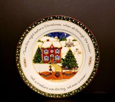 a plate with a christmas scene painted on it