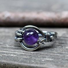 Amethyst sterling silver ringAn 8mm purple amethyst "floats" in a hand shaped sterling silver wire wrapped ring. ♥ The amethyst moves ♥ February Birthstone Ring, Wire Wrapped Ring, Jewelry Sale, Sterling Silver Wire Wrap, Diy Wire Jewelry, Wire Rings, Wire Wrapped Rings, February Birthstone, Ring Boho