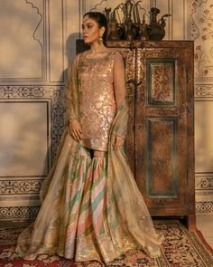 Buy Traditional Pakistani Wedding Gharara Dress in the alluring peach shade and premium fabric. This embroidered Gharara Kameez attire is available Online Wedding Gharara, Traditional Pakistani Wedding, Gharara Dress, Bridal Gharara, Gharara Designs, Anand Karaj, Song Lines, Bridal Dresses Pakistan, Suits Dress