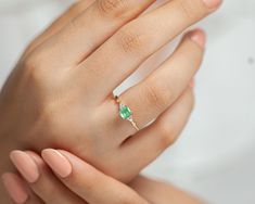 Dainty Ring , Emerald with 8 Diamonds, 14K Yellow Solid Gold , Handmade Ring , Minimal Ring Emerald 0,55 ct Diamond 0.08 ct G/H VSI Gram 1.13 GR Product Code: D0017868 About This Product: This gold rings are made of 14k gold, emerald and diamond stones. Since we use natural emerald, the color of the stone may differ. It is a perfect choice for elegant hands with elegant and minimal stance on hand. We made it with love and the best diamond. La Tua Luce is an ideal option for women who enjoy the l Delicate 14k Gold Emerald Cut Rings, Delicate Emerald Cut 14k Gold Rings, Dainty Emerald Cut Birthstone Ring, Dainty Emerald Ring With Prong Setting, Dainty Emerald Ring With Accent Stones For Anniversary, Dainty Solitaire Emerald Cut Emerald Ring, Dainty Emerald Ring With Accent Stones For Gift, Dainty Emerald Cut Emerald Ring, Dainty Emerald Cut Emerald Ring For Gift