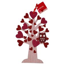 a tree with hearts and an owl hanging from it's trunk, on a white background