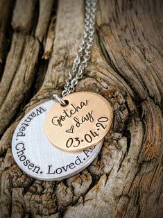 "Personalized hand stamped adoption necklace. Adoption day gifts. Gift for daughter. New mom gifts. Gotcha day jewelry. Blended family gifts. Adopt necklace. Foster child gifts. Adopted daughter gifts. Mothers day gifts. Adoptee gifts. Hand stamped and made to order. Made from a 3/4\" bronze disc, stamped with the phrase, \"Gotcha day,\" with a small heart stamp and the date of your choice. Underneath is a 1\" aluminum disc, stamped with the words, \"Wanted. Chosen. Loved. Adopted.\" Attached to Meaningful Hand Stamped Charm Necklace Gift, Personalized Inspirational Jewelry For Birthdays, Personalized Inspirational Jewelry For Birthday, Inspirational Personalized Jewelry For Birthday, Hand Stamped Necklace For Father's Day Gift, Meaningful Customizable Charm Necklace, Hand Stamped Jewelry Gift For Father's Day, Hand Stamped Charm Necklace For Valentine's Day, Adjustable Hand Stamped Charm Necklace As Gift For Mom