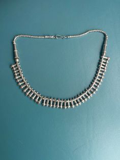 This is an original Fertility necklace in good silver and lovely smooth symbol beads, from about 1930s, from Ethiopia, Wollo/Tigrai regions.  Collected in the 1970s. The necklace has been restrung by me for pleasant wear, the back beads were added with sterling Asian beads,   It is an eye catcher and elegant look like within an open neckline. or within an open collar (blouse?)  I often wear it inside a collar and a long necklace of the Jimma beads on the outside and makes a great combination. or if volume, the long necklace double around the neck with this fertility necklace.  Really stunning. Old Silver Coins, Green Aventurine Necklace, Rare Beads, Boho Jewels, Silver Coin Necklace, Moroccan Jewelry, Aventurine Necklace, Necklace Top, Vintage Beads Necklace