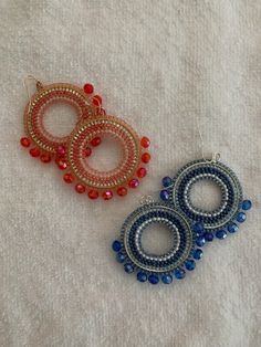 These genuine, hand-beaded Native American hoop earrings include size 11 seed beads and larger faceted beads accenting the bottom half. If you're a morning person, "Tequila Sunrise" is made with beautiful shades of pink, rose gold, and a light vermillion. More of a night owl? "Moonlight Magic" consists of the soft blues and silvers of a midnight stroll. If you want your earrings to turn some heads and make some noise (figuratively speaking), one of these pairs (maybe both?) would be a fabulous option. Small Hoop Beaded Earrings With Faceted Beads For Gift, Gift Small Hoop Beaded Earrings With Faceted Beads, Party Beaded Hoop Earrings With Round Beads, Party Hoop Earrings With Round Beaded Details, Bohemian Hoop Beaded Earrings With Faceted Beads, Artisan Beaded Hoop Earrings, Make Some Noise, Tequila Sunrise, Morning Person