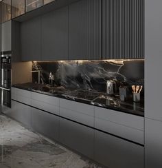 a modern kitchen with marble counter tops and stainless steel appliances, along with black cabinets