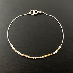 "This Morse code bracelet have beads floating on a delicate specialty chain. The mixed metal beads form a sophisticated, modern design. It is a subtle way to send your love message. Also a perfect daily reminder for love, inspiration, and mental health. ❤️ Matching morse code necklace: https://etsy.me/31Vv2Qm ∙ ∙ ∙ ∙ ∙ ∙ ∙ ∙ ∙ ∙ ∙ ∙ ∙ ∙ ∙ ∙ ∙ ∙ ∙ ∙ ∙ ∙ ∙ ∙ ∙ ∙ ∙ ∙ ∙ ∙ ∙ ∙ ∙ ∙ ∙ ∙ ∙ FEATURES ▶ All materials are sterling silver and 14K gold filled. Hypoallergenic. Suitable for sensitive skin. ▶ Be Minimalist Gold Sterling Silver Bracelet As Gift, Adjustable Minimalist Gold Bracelet With Satellite Chain, Minimalist Adjustable Chain Bracelet With Gold Beads, Minimalist Adjustable Gold Beads Chain Bracelet, Minimalist Adjustable Gold Beaded Chain Bracelet, Dainty Gold Sterling Silver Bracelet, Gold Sterling Silver Bracelet With Round Beads, Adjustable Beaded Bracelets With Satellite Chain, Adjustable Gold Beaded Bracelet With Satellite Chain