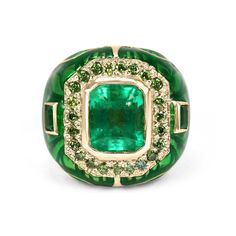 A men's medium, rich, vivid-green Colombian emerald & green diamond cluster gold ring 18K. This superior ring features a high quality, natural emerald cut emerald. The rare gemstone has a desirable color and transparent eye clarity. The Colombian emerald is bezel set and is accented by a halo of brilliant genuine green diamonds that are also bezel set. Accenting the enamel band are two deep green natural emerald cuts set horizontally. A beautiful contrast is seen with an array of vibrant greens. Mens Emerald Rings, Ring Man, Emerald Blue, Gold Color Ring, Gold Cocktail Ring, Gold Cocktail, Ring Emerald, Colombian Emeralds, 18k Gold Ring