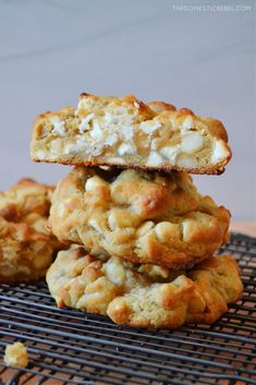 three cookies stacked on top of each other with marshmallows in the middle