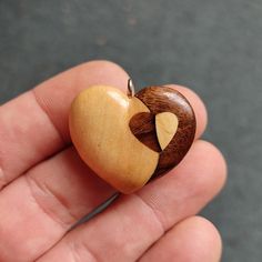 "This unique Heart pendant, is hand made out of black walnut and maple wood, using the inlay technique. This handmade wooden necklace is one of a kind and is a perfect daily accessory and suitable for special occasions. This wooden pendant is a special gift for him and her. It comes with Korean waxed cord and has lobster clasp at the end. You can chose between several options on how long you want the necklace to be -18\", 20\", 24\", and 30\"  inches . For custom necklace lengths send me a messa Natural Wood Jewelry With Variations For Gift, Natural Wood Jewelry With Variations For Gifts, Natural Wood Jewelry With Variations As A Gift, Natural Wood Jewelry With Natural Variations As Gift, Natural Wood Jewelry With Variations, Natural Wood Jewelry With Natural Variations, Unique Brown Heart-shaped Necklace, Walnut Wood Jewelry Gift, Special Gifts For Him