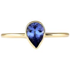 Introducing our exquisite 14 Karat Yellow Gold Ring adorned with a stunning 0.50 Carat Natural Tanzanite gemstone. Stamped for authenticity, this ring weighs a mere 1.2 grams, ensuring comfort and wearability. The Tanzanite gemstone, boasting a weight of 0.50 carats, showcases a mesmerizing hue and measures 6.00x4.00 mm. With its elegant design and vibrant gemstone, this ring adds a touch of sophistication to any ensemble. Elevate your look with this timeless treasure, crafted to inspire and captivate. 0.50 Carat Natural Tanzanite 14 Karat Yellow Gold Ring Stamped: 14K Yellow Gold Total Ring Weight: 1.2 Grams Natural Tanzanite Weight is 0.50 Carat Face Measures: 6.00x4.00 mm Sku: [703381W] Crystal City, Gold Rings Fashion, Daily Jewelry, Tanzanite Ring, Tanzanite Gemstone, Modern Ring, Natural Tanzanite, Chic Jewelry, Yellow Gold Ring