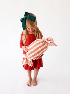 "This Peppermint Candy Pillow in a vintage inspired red and cream stripe is a whimsical addition to your Christmas decor.   The peppermint striped linen cover is removable and machine wash & dry friendly.  Cream linen ties with hand-pulled fringe complete the peppermint candy pillow.  A 12\" pillow form is included. Features: Cream and red striped linen sleeve with hand-pulled, fringed cream ties 12\" pillow insert INCLUDED Cover is easily removed for machine wash and drying Oeko-Tex Certified L Oversized Christmas Decorations, Peppermint Pillow, Candy Pillow, Candy Pillows, Artist Ideas, Christmas Throw Pillow, Christmas Throws, Fun Christmas Decorations, Pillow Form