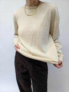 Lovely cashmere crewneck knit in a soft shade of sand. The sweater has a round neckline, long sleeves, and is perfect for spring weather and layering. Tag reads TSE Cashmere Repair at the front left shoulder and faint markings at the front midsection. Beige Crew Neck Soft Knit Sweater, Beige Soft Knit Crew Neck Sweater, Neutral Long Sleeve Cashmere Sweater, Classic Cashmere Sweater In Neutral Color, Oversized Fine Knit Beige Sweater, Oversized Neutral Crew Neck Sweater, Fine Knit Long Sleeve Sweater In Neutral Color, Cream Long Sleeve Sweater With Ribbed Neckline, Oversized Classic Beige Sweater