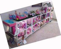 a doll house with lots of furniture and accessories