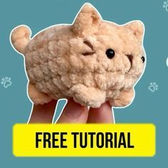 a hand holding a small stuffed animal with the words free tutor on it's side