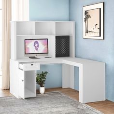 a white corner desk with a computer on it