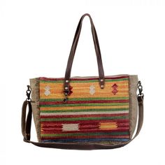 "Technicolor Weekender bag. Up your style game with this spacious, floral printed handbag. This sturdy bag is ideal for an everyday casual look Additional Information Item Width 16.5\" Item Depth 8\" Item Height 12\" Handle 11.5\" Shoulder 22\" PLEASE NOTE: Each of these bags is truly an original! Much of the materials are recycled from used tarps and tents. These tarps have literally traveled the world and carry the scars and bruises of use. Though we take great care to launder all of our mater Casual Multicolor Large Capacity Satchel, Casual Rectangular Shoulder Bag For Weekend, Canvas Rectangular Satchel With Adjustable Handle, Rectangular Canvas Satchel With Adjustable Handle, Canvas Satchel With Adjustable Handle, Multicolor Casual Canvas Travel Bag, Casual Multicolor Canvas Travel Bag, Multicolor Shoulder Bag For Weekend, Rectangular Canvas Bag With Adjustable Handle For Travel