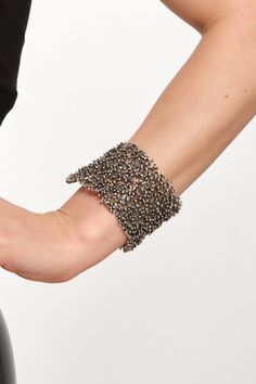 Unveil your inner bohemian spirit with ZeyDor Accessories' newest addition: a chunky, statement-making silver-plated cuff. Each piece is a labor of love, handcrafted to embody unique characteristics and offer an adjustable fit for all wrist sizes. The intricate texture captures the essence of bohemian chic, making it a bold accessory that complements any outfit. Whether it's a casual day out or a sophisticated evening event, this bracelet elevates your style with its eye-catching design. Its ver Bohemian Black Metal Cuff Bracelet, Bohemian Silver Cuff Bracelet For Parties, Silver Bohemian Cuff Bracelet For Party, Bohemian Cuff Bracelets For Party, Silver Beaded Metal Cuff Bracelet, Bohemian Metal Cuff Bracelet For Parties, Silver Beaded Cuff Bracelet For Festival, Beaded Cuff Bracelet, Bold Accessories