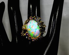 Luxury Multicolor Amethyst Ring As Gift, Luxury Multicolor Amethyst Ring Gift, Luxury Multicolor Amethyst Ring For Gift, Elegant Multicolor Cabochon Opal Ring, Multicolor Opal Gemstone Ring Gift, Unique Oval Opal Ring For Jewelry Making, Formal Multicolor Opal Gemstone Ring, Multicolor Opal Gemstone Ring, Elegant Unique Opal Ring Gift